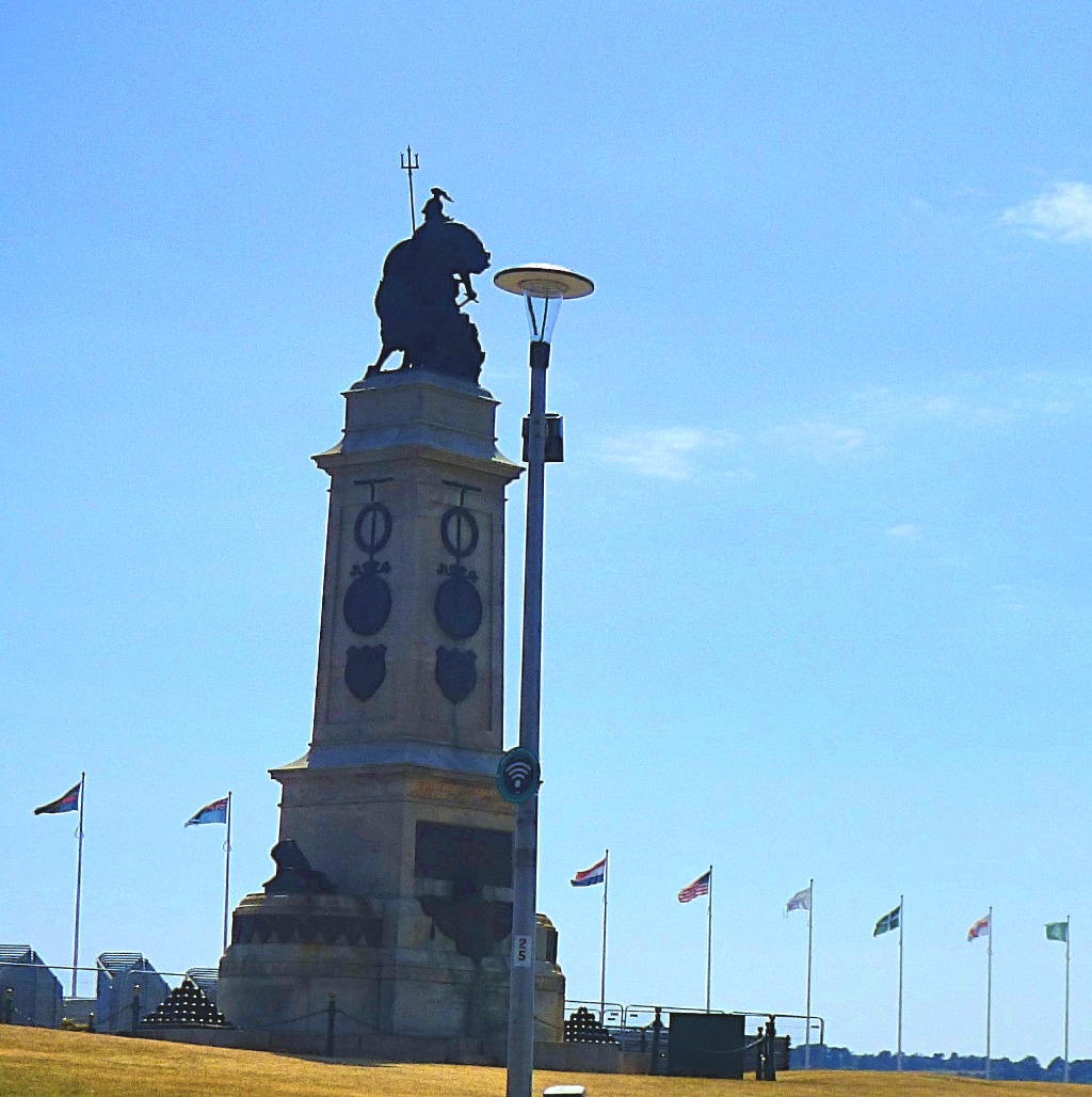 statue and flags